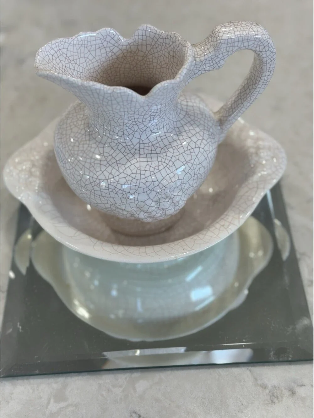 Farmhouse-style pitcher and basin set, featuring a distinct white crackle finish
